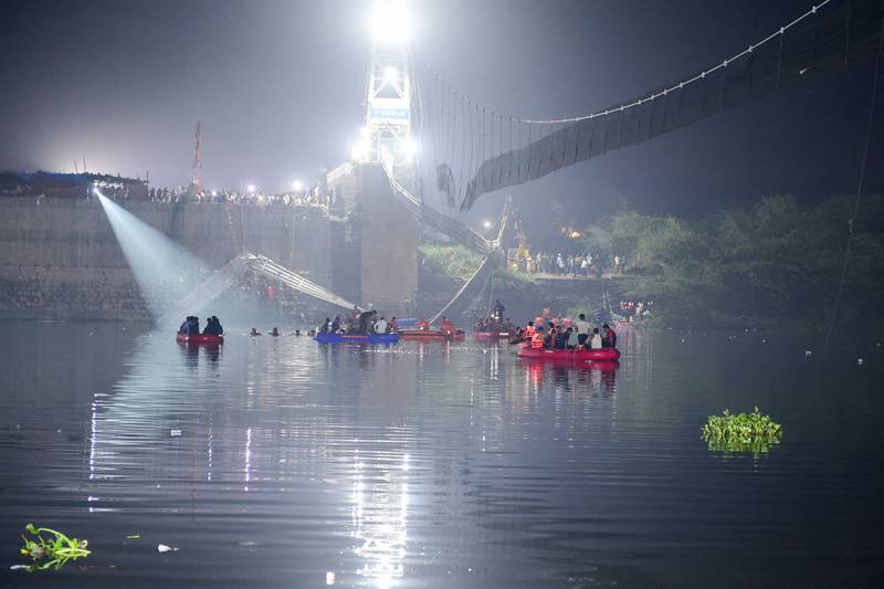 Indian rescuers search the Machchhu for survivors of the bridge collapse on October 31. AFP