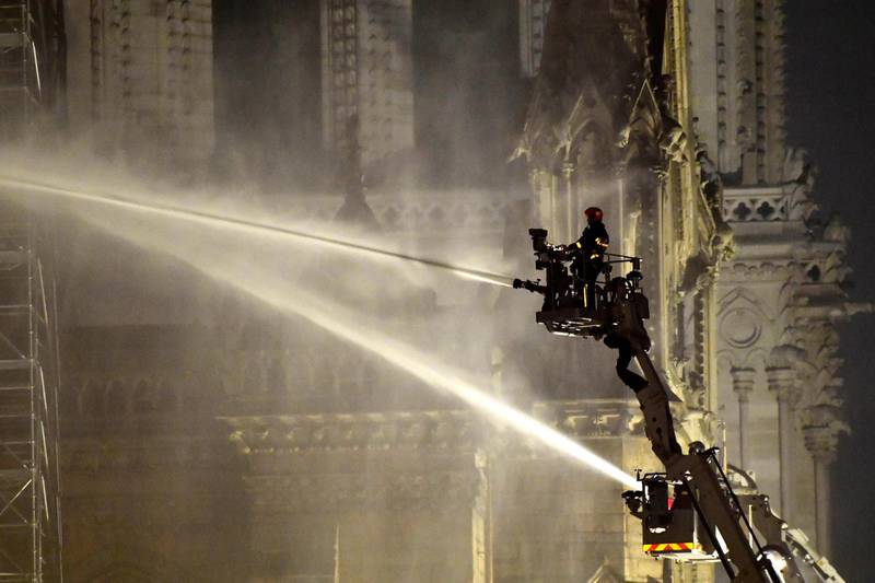Firefighters spray water to extinguish the flames. EPA