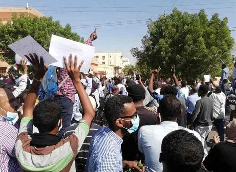 In this Tuesday Dec. 25, 2018 handout photo provided a Sudanese activist, people chant slogans during a demonstration in Khartoum, Sudan. Police used tear gas and fired in the air Tuesday to disperse thousands of protesters attempting to march on the presidential palace to demand that Omar Bashir, Sudan's president of 29 years, step down, according to activists and video clips posted online. (Sudanese Activist via AP)
