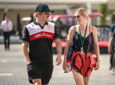 Alfa Romeo driver Valtteri Bottas with girlfriend, Tiffany Cromwell, arrive at Yas Marina Circuit.
