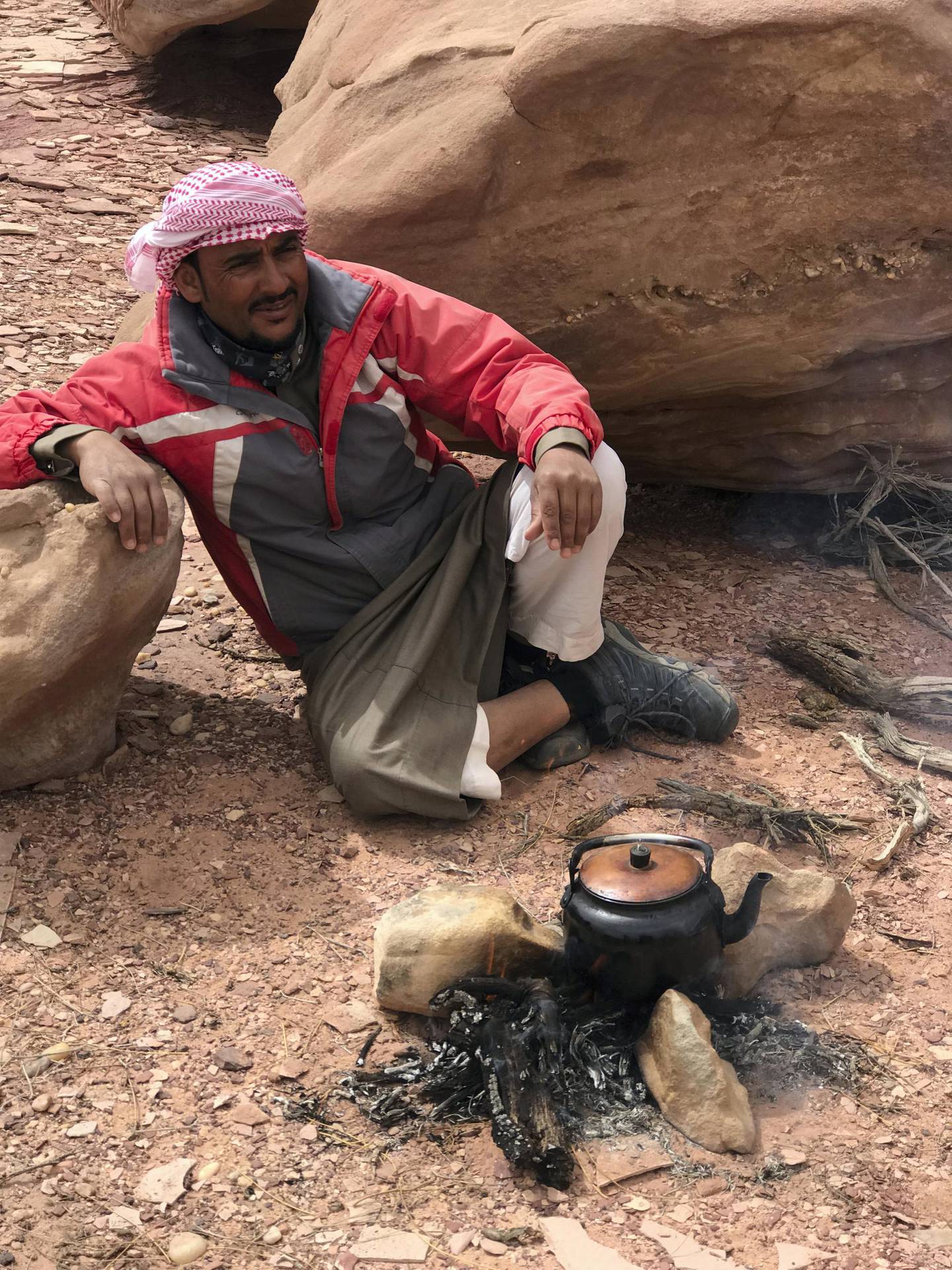 Salem stops to brew tea during a trek in Wadi Rum. 