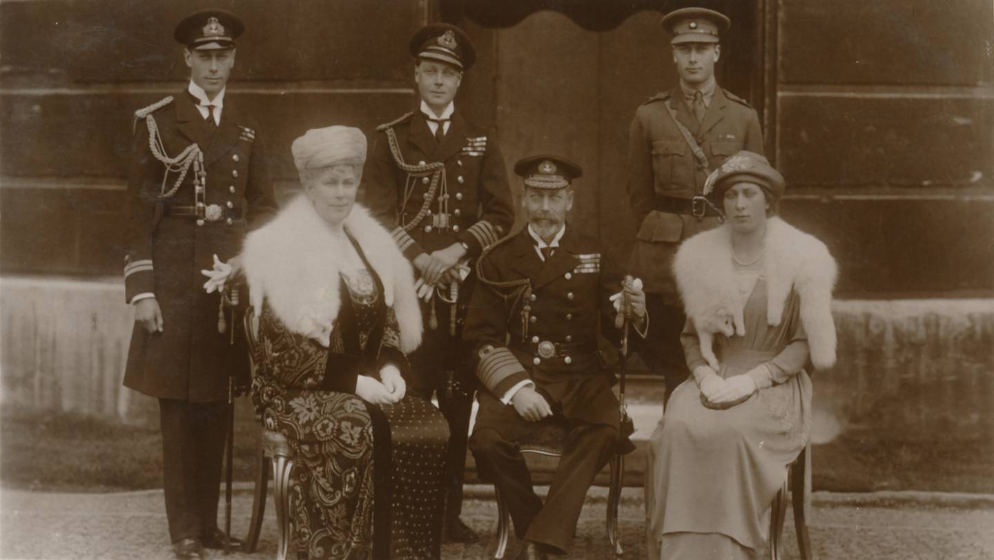 King George V, seated center, his wife Queen Mary, seated left, and their children were listed on the 1921 census as residing at Windsor Castle in south-eastern England with over 150 servants .  Getty Images