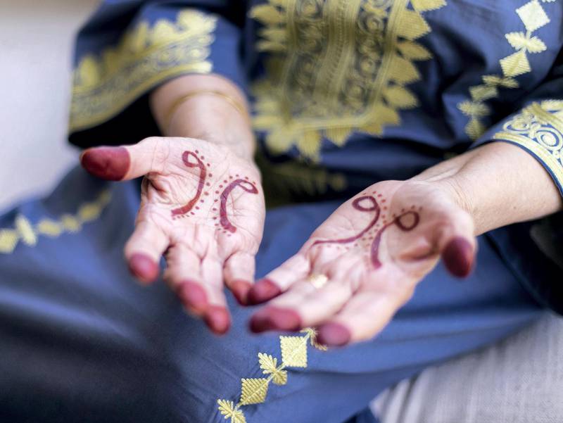 DUBAI, UNITED ARAB EMIRATES. 1 AUGUST 2019. Azra’s grandmother, Amina, hands adroned with henna.Azra Khamissa is a Dubai based Canadian/South-African chiropractor, fashion designer, and henna artist. (Photo: Reem Mohammed/The National)Reporter:Section: AC