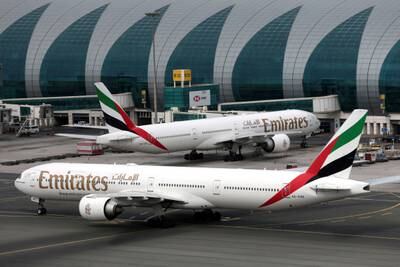 Emirates airline's Boeing 777-300ER jets at Dubai International Airport. Reuters
