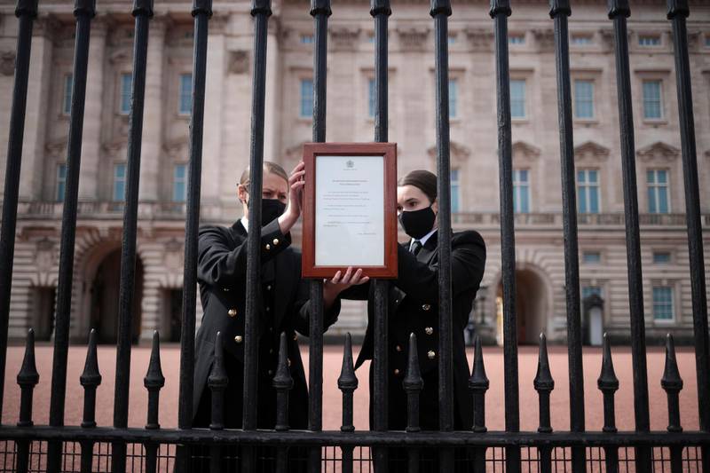An announcement is attached to the fence of Buckingham Palace. Reuters