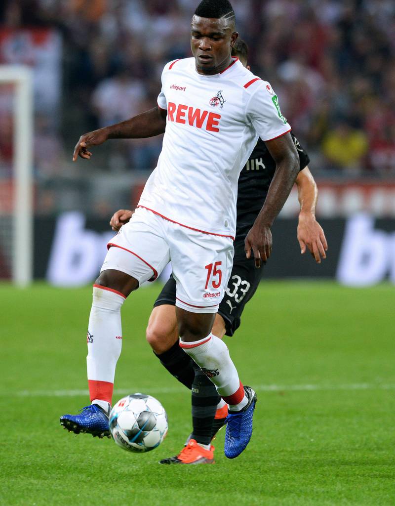 Cologne's Colombian forward Jhon Cordoba (front) and Dortmund's German midfielder Julian Weigl vie for the ball during the German first division Bundesliga football match 1 FC Cologne v BVB Borussia Dortmund in Cologne, western Germany on August 23, 2019. (Photo by UWE KRAFT / AFP) / RESTRICTIONS: DFL REGULATIONS PROHIBIT ANY USE OF PHOTOGRAPHS AS IMAGE SEQUENCES AND/OR QUASI-VIDEO
