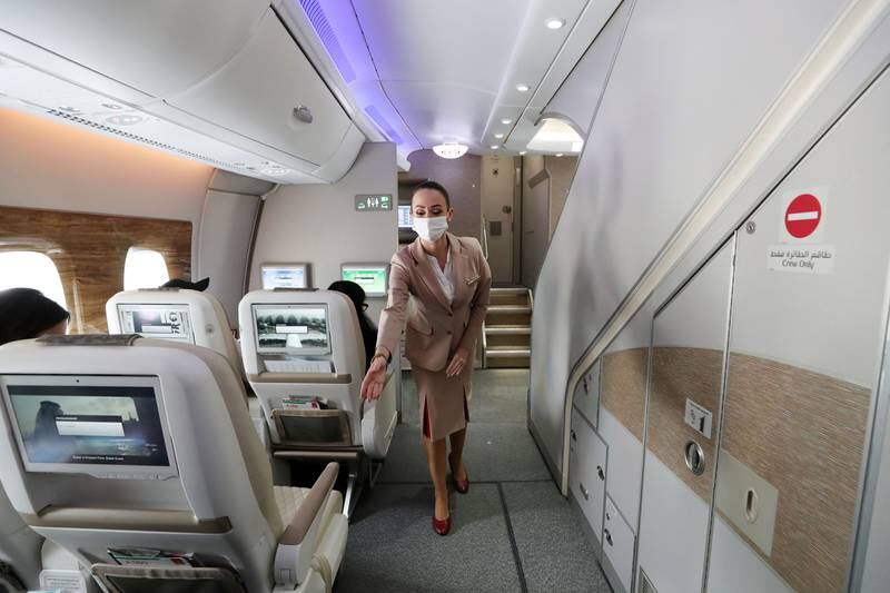 An Emirates crew member performs a safety briefing in the premium economy cabin of the A380. Chris Whiteoak / The National