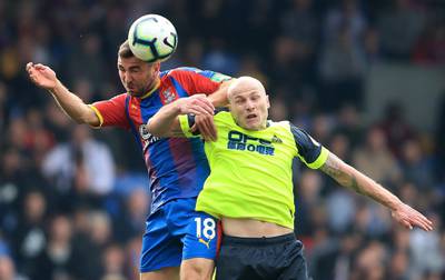 Aaron Mooy of Huddersfield Town competes for a header with James McArthur of Crystal Palace. Getty Images