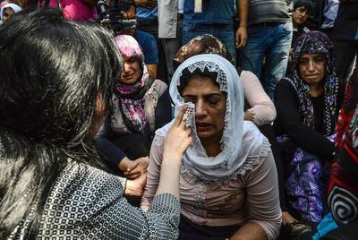 Women cry during a funeral for victims of the attack on a wedding party that left 50 dead in Gaziantep in southeastern Turkey near the Syrian border on August 21, 2016. Ilyas Akengin/AFP