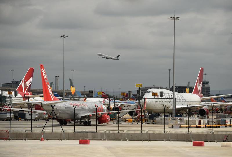 Planes are pictured on the tarmac at Manchester Airport. AFP