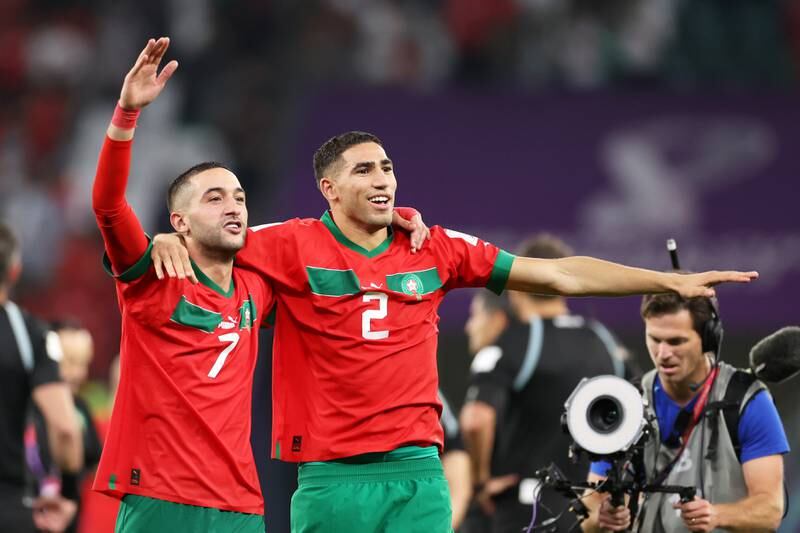 Hakim Ziyech and Achraf Hakimi of Morocco celebrate after their penalty shoot-out victory in the World Cup last-16 match against Spain at Education City Stadium on December 6, 2022. Getty 