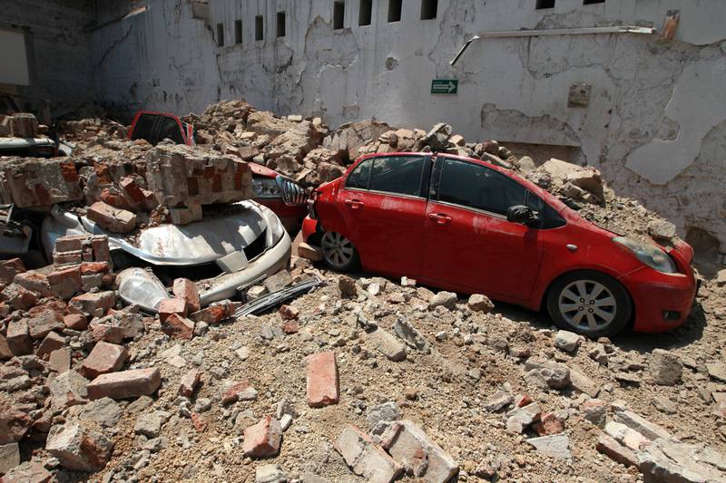 Vehicles damaged by debris following a magnitude 7.1 earthquake on the Richter scale in Mexico City. Alejandro Cruz / EPA