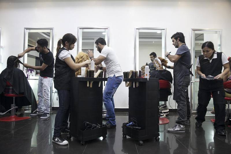 Hairstylists work away the night at the Lebanese operated hair salon Artistic Hair. The salon owner, Nicholas Baaklini, opened the salon 7 years ago and has built a solid clientele and reputation. 