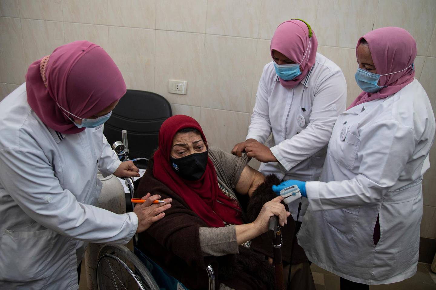 An Egyptian woman receives Covid-19 vaccination.