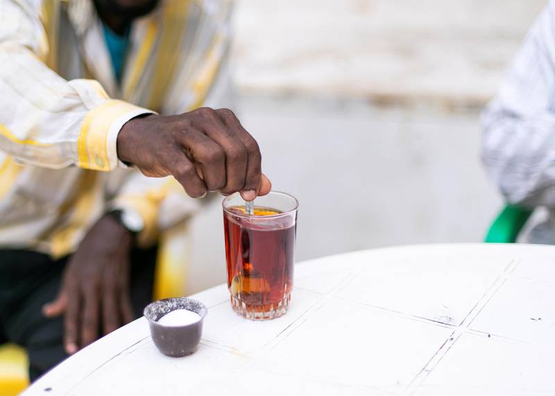 JEDDAH, KINGDOM OF SAUDI ARABIA. 2 OCTOBER 2019. Men having some tea in the alleyways of Al Balad, Jeddah’s historical district. The World Heritage Site was founded in the seventh century and was once the beating heart of Jeddah, Saudi Arabia’s second-largest city. The town was formed as an ancient trading port and acted as the primary gateway to Makkah. Today, it is famous for its traditional buildings, which were constructed with coral-stone and decorated with intricate latticed windows.(Photo: Reem Mohammed/The National)Reporter:Section: