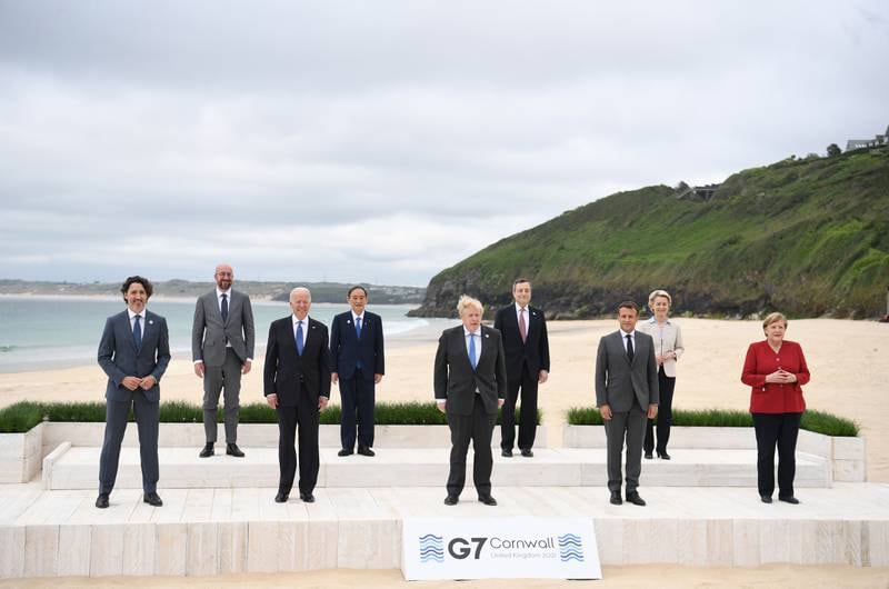 Britain's Prime Minister Boris Johnson, centre, poses with the G7 leaders for a family photo during the G7 Summit in Carbis Bay, Britain, on June 11. With him are US President Joe Biden second left, front, Canada's Prime Minister Justin Trudeau left, France's President Emmanuel Macron second-right, front, German Chancellor Angela Merkel, right, Italy's Prime Minister Mario Draghi, second-right, rear, Japan's Prime Minister Yoshihide Suga, second-left, rear, European Commission President Ursula von der Leyen, right, rear and European Council President Charles Michel, left, rear. EPA