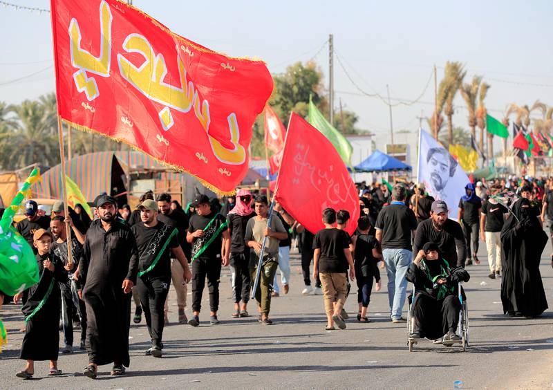 Shi'ite Muslim pilgrims walk to the holy city of Kerbala, ahead of the holy Shi'ite ritual of Arbaeen in Baghdad, Iraq.  REUTERS