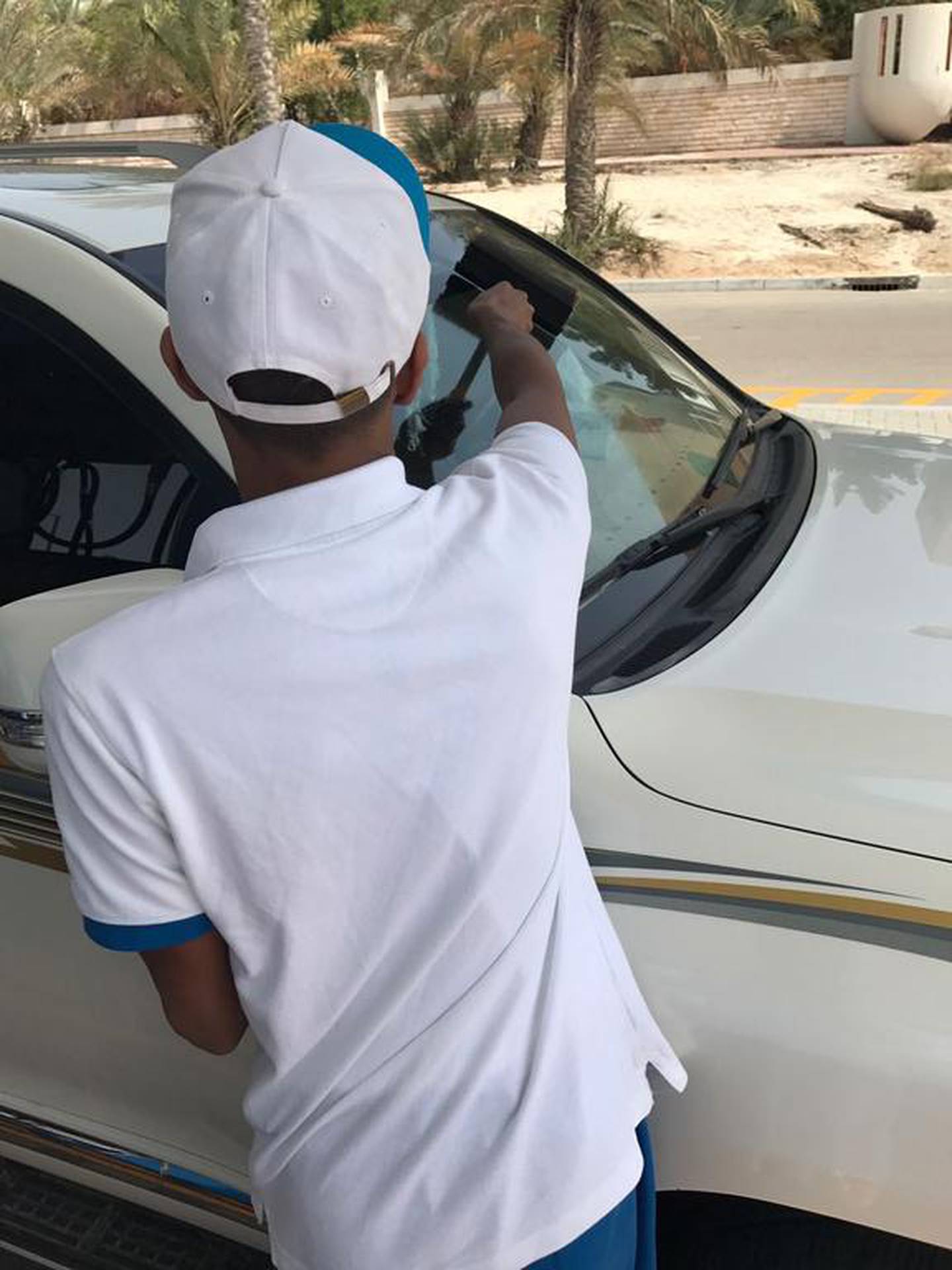 One man in Abu Dhabi served his community service for reckless driving at petrol station. Courtesy Abu Dhabi Judicial Department