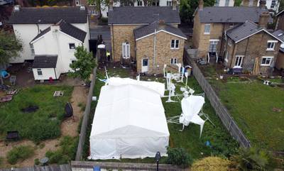 A tent at the back garden of a property in Peckham is seen as investigations continue. Reuters