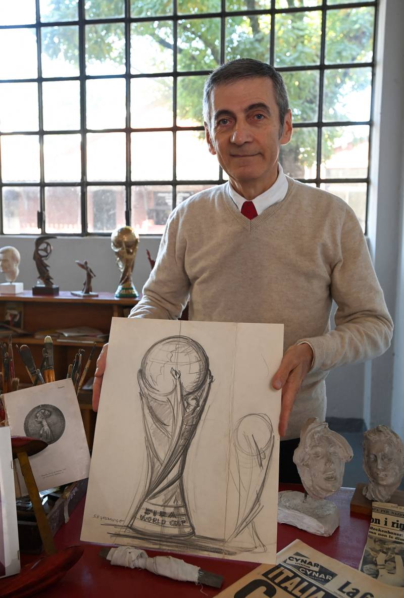Giorgio shows the first sketch of the Fifa World Cup trophy, created by his father as 'a way to express the love for the sport and the trust of the sport'. Reuters
