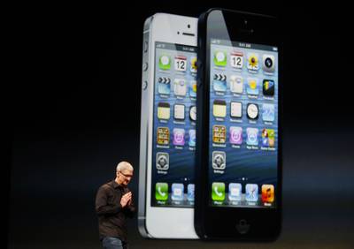 Apple CEO Tim Cook takes to the stage following the reveal of the iPhone 5 in San Francisco, California, on September 12, 2012. This was the first 4-inch screen and the phone was faster and slimmer. Reuters
