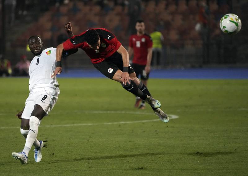 Egypt's Ashour, right, jumps for the ball with Guinea's Naby Laye Keita during their soccer match in Group D 2023 Cup of Nations (AFCON) qualifiers at Cairo International stadium in Cairo, Egypt.  Egypt won 1-0.  AP Photo