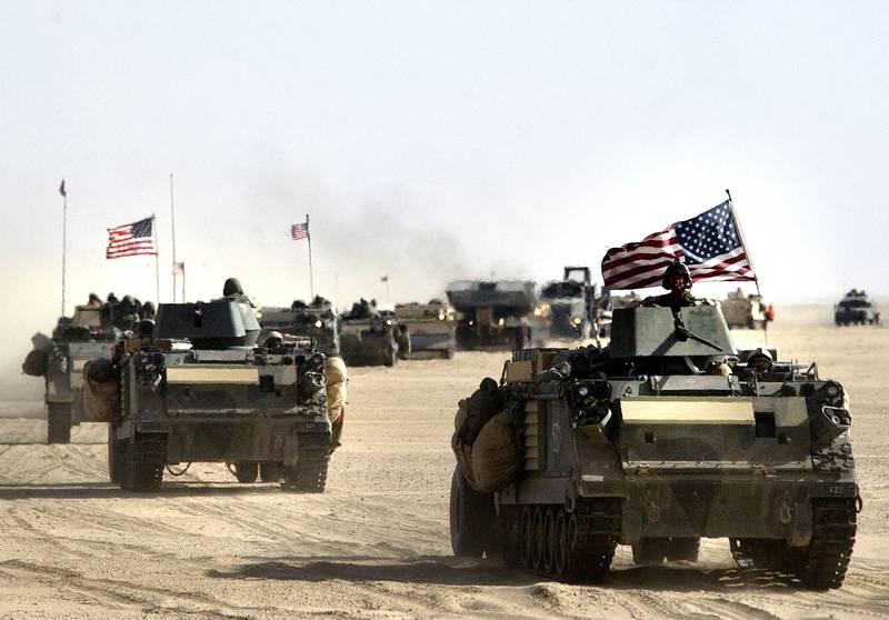 March 18, 2003: US and British forces move into position before a possible military strike near the Kuwait-Iraq border. A day prior, Mr Bush gave Iraqi President Saddam Hussein and his sons 48 hours to leave the country or face war. Getty 
