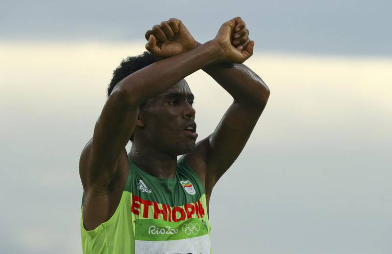 Ethiopian marathon runner Feyisa Lilesa gestures in support of his tribe, the Oromo, after Sunday’s race at the Rio Olympic Games. Reuters