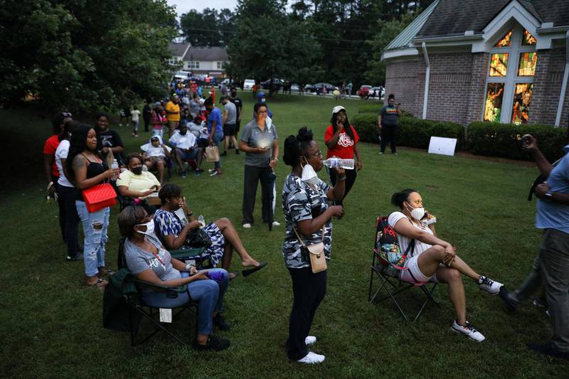 Voters wait at Christian City, an assisted living home, to cast their ballots after Democratic and Republican primaries were delayed due to coronavirus restrictions in Union City, Georgia. Reuters