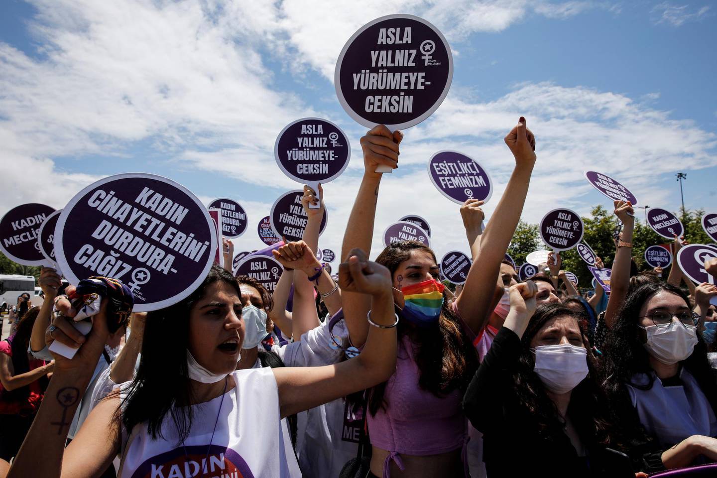 Activists shout slogans and hold signs during a protest against Turkey's withdrawal from the Istanbul Convention, an international accord designed to protect women, in Istanbul, Turkey, June 19, 2021. REUTERS/Umit Bektas