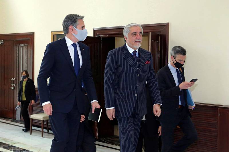 Abdullah Abdullah, Chairman of the High Council for National Reconciliation, center, walks with US Secretary of State Antony Blinken at the Sapidar Palace in Kabul. AP