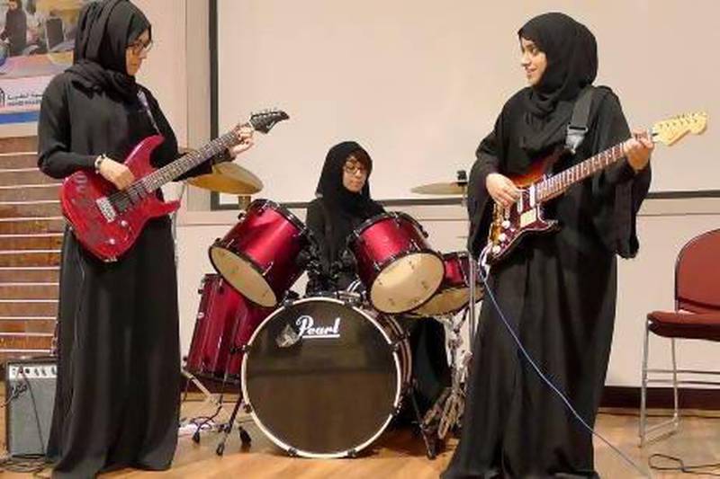 Members of the Al Ain-based rock band Random Stars are, left to right: Bushra Hassan Al Hashimi, 22, rhythm guitar,  Aysha Abdullah Almaskari, 21, drums, and Hamda Al Ghaithi, 22, lead guitar. Photo courtesy Patreshia Tkach