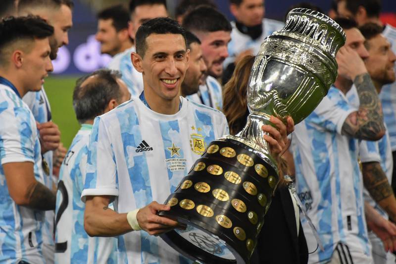Argentina's Angel Di Maria holds the trophy after winning the Copa America. AFP