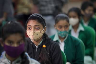 Indian students visit their school for a COVID-19 vaccine dose in Kolkata Eastern India.  Indian government announced a Covid-19 vaccine drive for students aged 15 to 18 at their schools from 03 January 2022.   EPA
