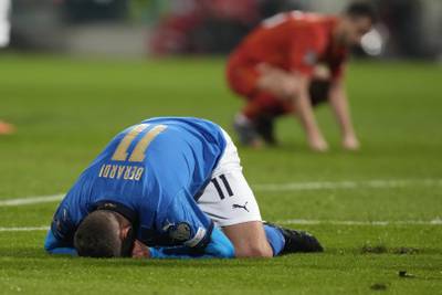 Italy's Domenico Berardi on his knees after missing a chance. AP