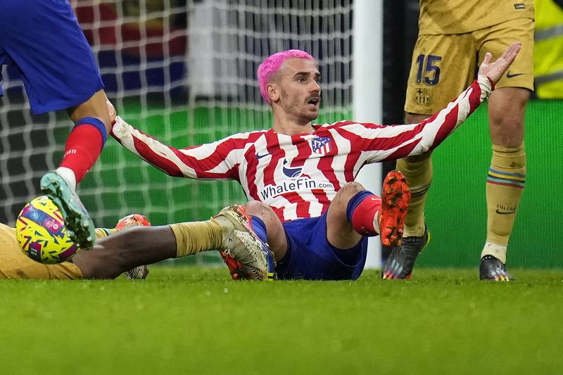 Atletico Madrid's Antoine Griezmann reacts after a challenge. AP Photo 