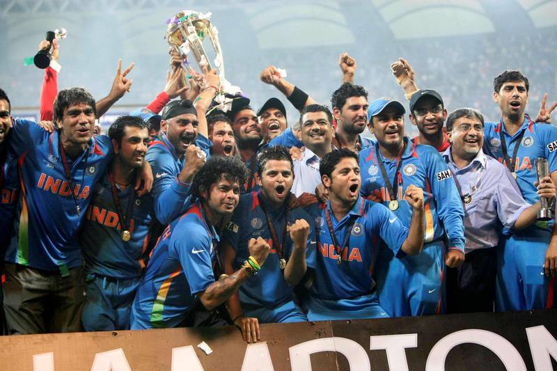 MUMBAI, INDIA - APRIL 02:  Indian cricketers pose with the trophy after victory in the Cricket World Cup 2011 final over Sri Lanka at The Wankhede Stadium in Mumbai on April 2, 2011. India beat Sri Lanka by six wickets. (Photo by Naveen Jora/India Today Group/Getty Images)