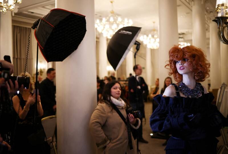 A model prepares backstage before the Paul Costelloe catwalk show, during London Fashion Week. Reuters