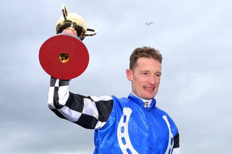 Mark Zahra celebrates with the trophy after winning race seven. Getty Images
