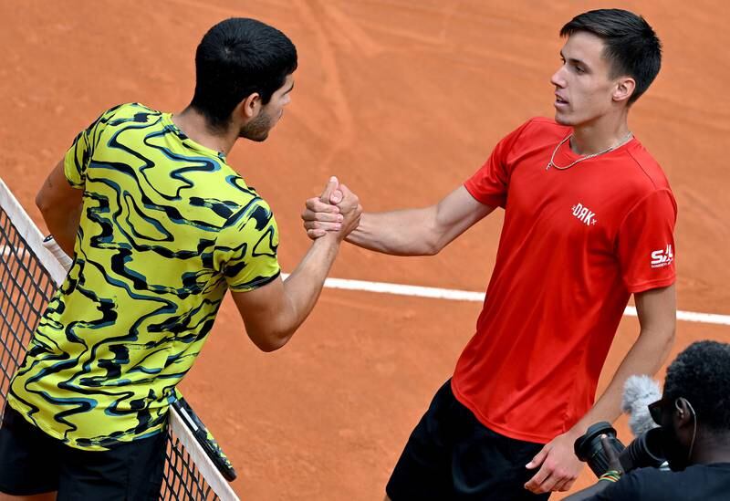 Fabian Marozsan, right, after beating Carlos Alcaraz in the third round of the Italian Open in Rome on May 15, 2023. EPA