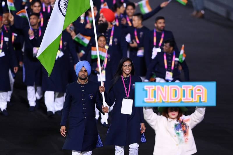 Manpreet Singh and PV Sindhu, flagbearers of Team India, lead the athletes out. Getty Images