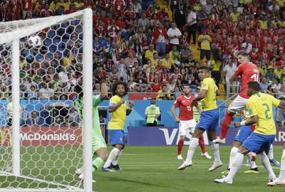 Switzerland's Steven Zuber, second from right, scores his side's opening goal during the group E match between Brazil and Switzerland at the 2018 soccer World Cup in the Rostov Arena in Rostov-on-Don, Russia, Sunday, June 17, 2018. (AP Photo/Themba Hadebe)