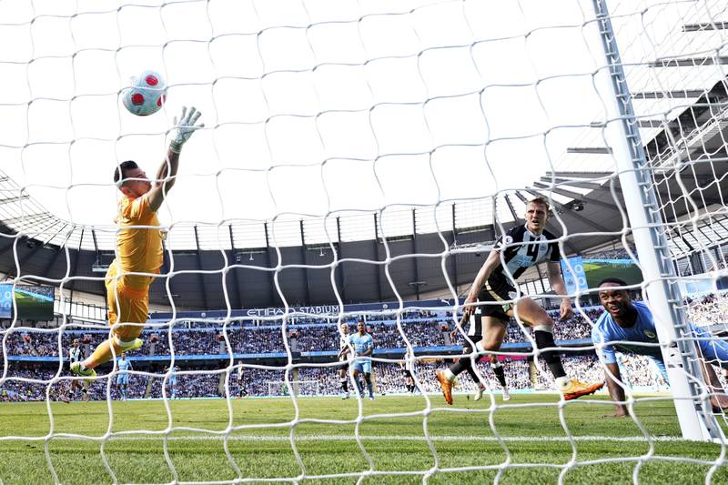 Newcastle goalkeeper Martin Dubravka cannot stop City's Raheem Sterling scoring the first goal. AP
