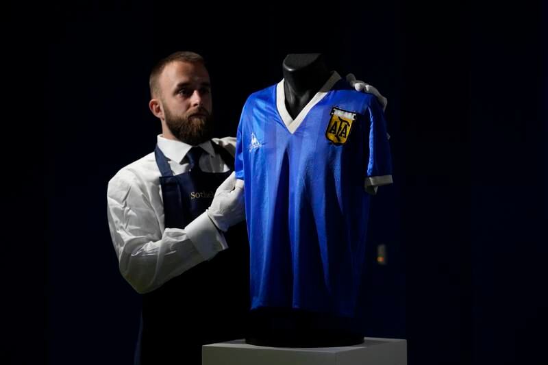 The Argentina shirt worn by Diego Maradona in the 1986 Mexico World Cup quarter-final against and England - in which he scored the "Hand of God" goal - is displayed at Sotheby's auction house in London. AP