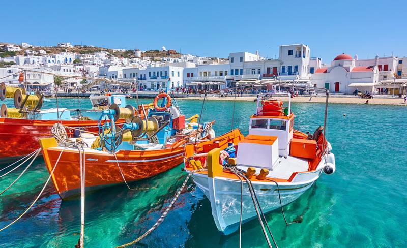 Harbour with wooden fishing boats in Chora town on sunny summer day, Mykonos island, Greece -- Greek landscape