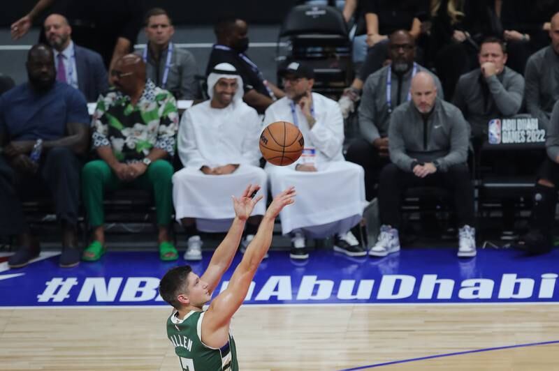 Left, Shaquille O'Neal and Steve Harvey look on as Grayson Allen of the Milwaukee Bucks takes a shot. EPA