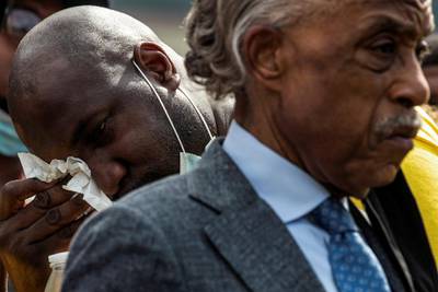 Reverend Al Sharpton is seen in the foreground as Philonise Floyd, brother of George Floyd, wipes tears away after speaking during the public viewing of Floyd at The Fountain of Praise church in Houston. REUTERS