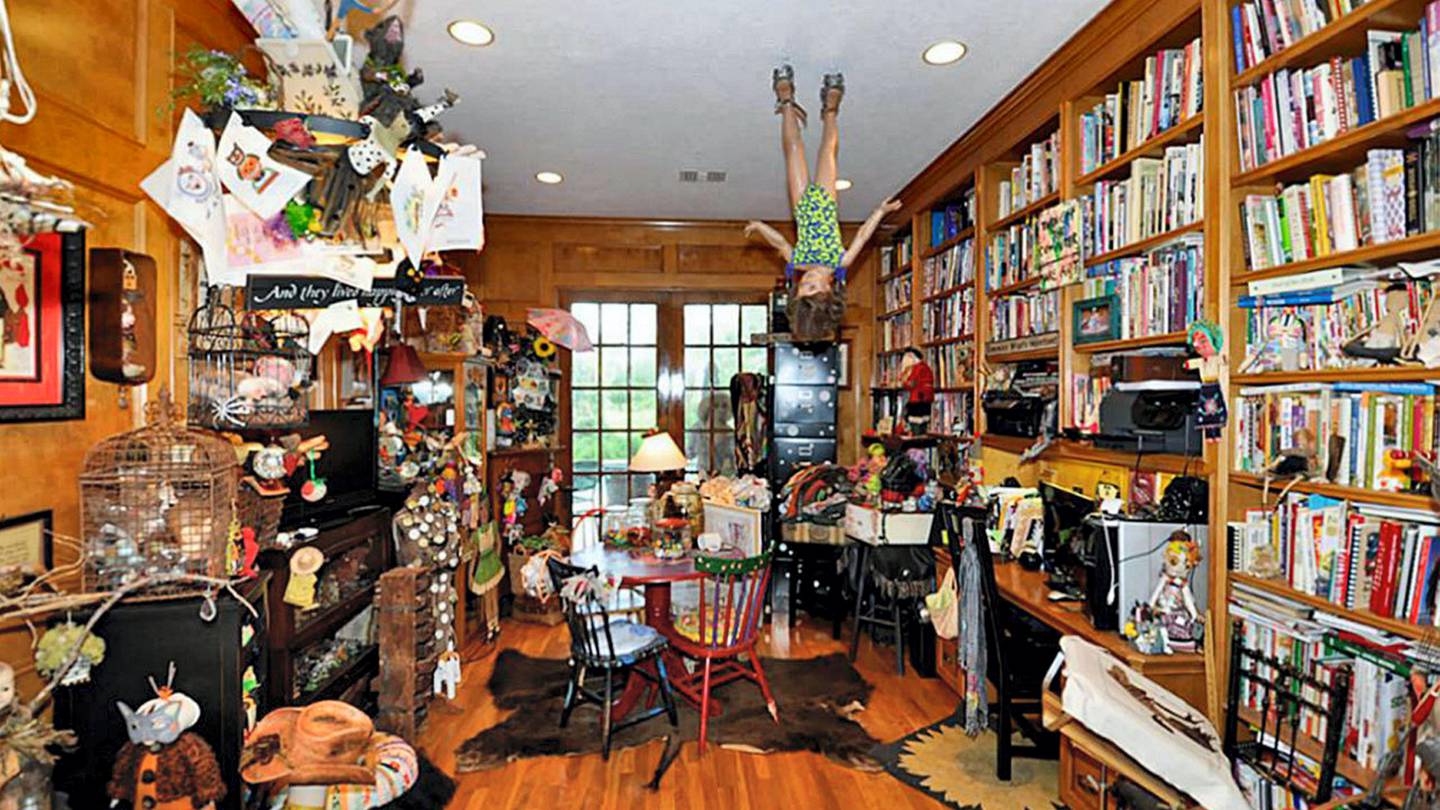 An upside-down doll hangs from the ceiling at Mannequin House