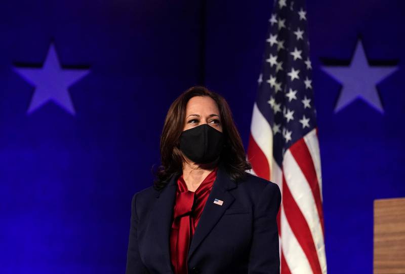 Vice presidential nominee Kamala Harris looks on as US Democratic presidential nominee Joe Biden speaks about election results in Wilmington, Delaware. Reuters