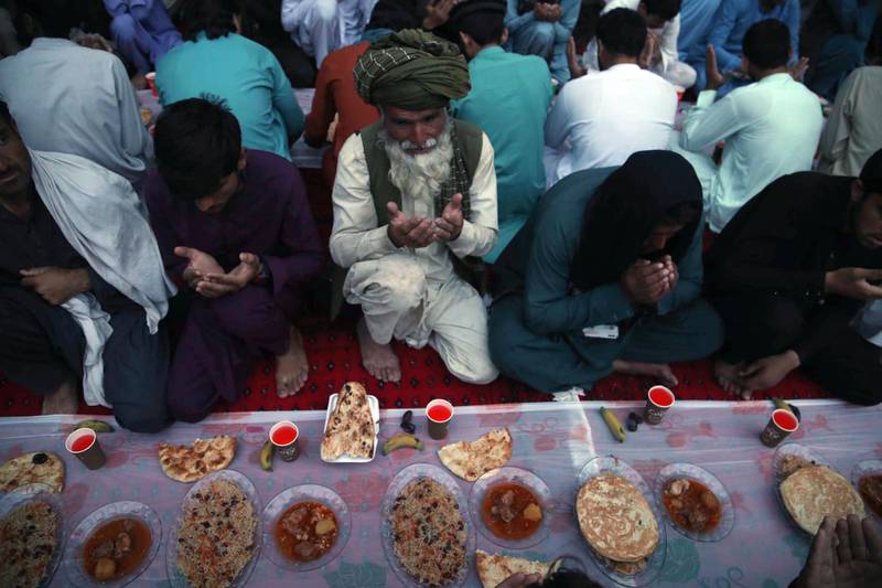Worshippers pray before breaking their fast in Jalalabad, Afghanistan. EPA